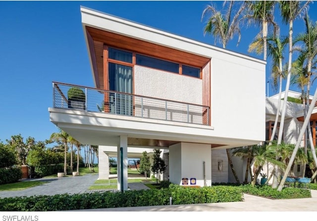 view of front of property with a balcony