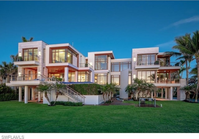 back of property featuring a lawn