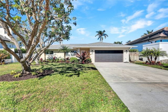 ranch-style home featuring a front yard and a garage