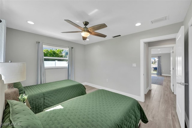 bedroom featuring light wood-type flooring and ceiling fan