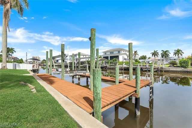 view of dock featuring a yard and a water view