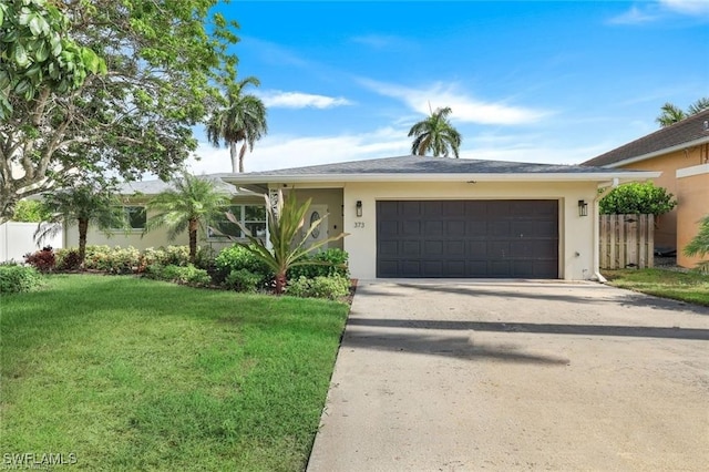 single story home featuring a front yard and a garage