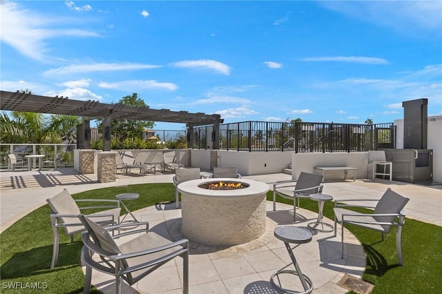 view of patio featuring an outdoor fire pit and a pergola