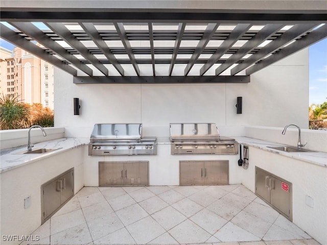 view of patio / terrace featuring area for grilling, sink, and grilling area