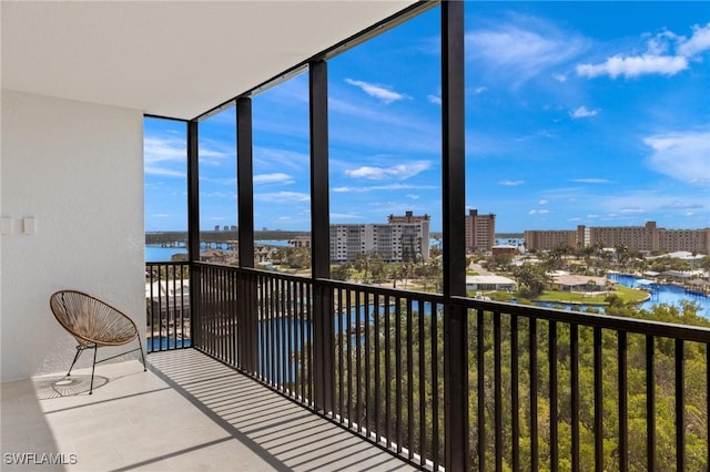 unfurnished sunroom with a water view