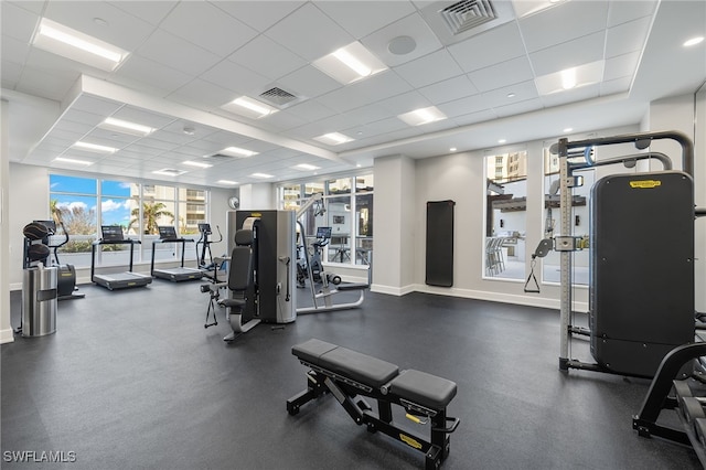 workout area with a drop ceiling