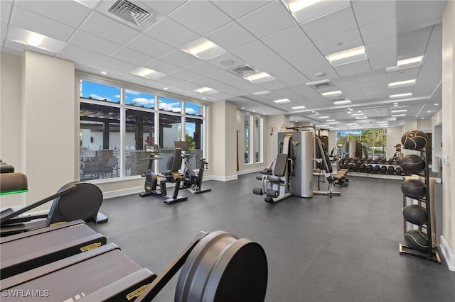 exercise room featuring a paneled ceiling