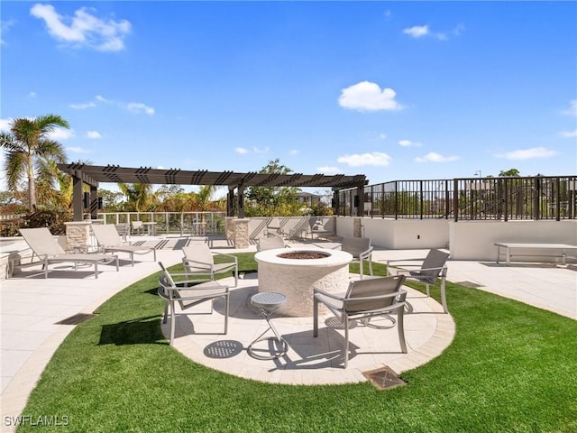 view of patio featuring a pergola and an outdoor fire pit