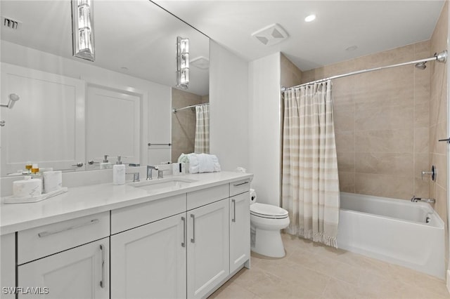 full bathroom with vanity, toilet, tile patterned flooring, and shower / bath combo