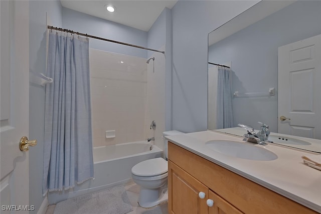 full bathroom featuring tile patterned flooring, shower / tub combo with curtain, vanity, and toilet