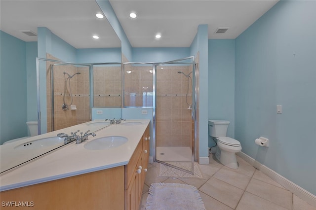 bathroom with vanity, an enclosed shower, tile patterned floors, and toilet