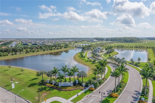 birds eye view of property featuring a water view