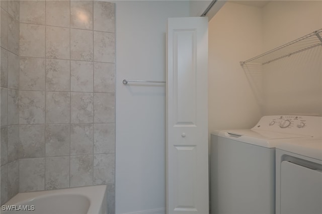 laundry area featuring washing machine and dryer