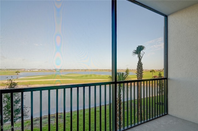 balcony featuring a water view