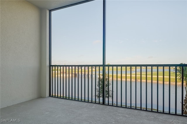 balcony featuring a water view