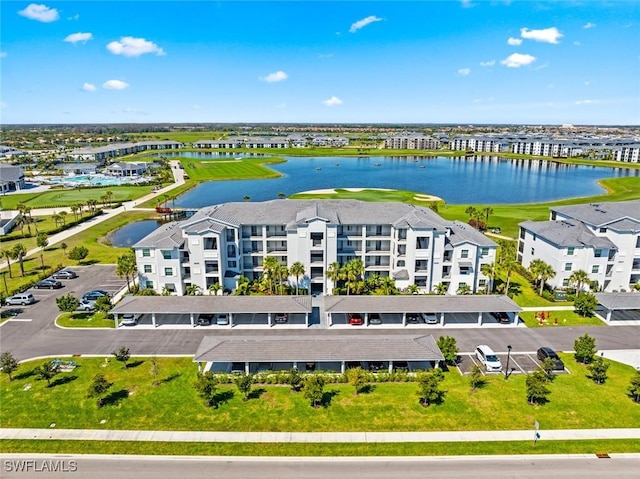 birds eye view of property with a water view