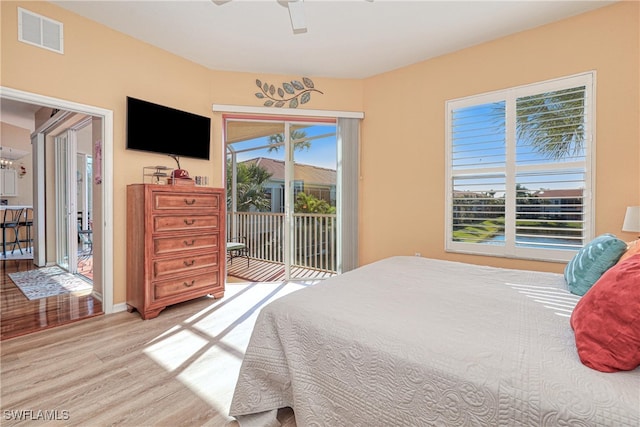 bedroom featuring ceiling fan, access to exterior, and light wood-type flooring