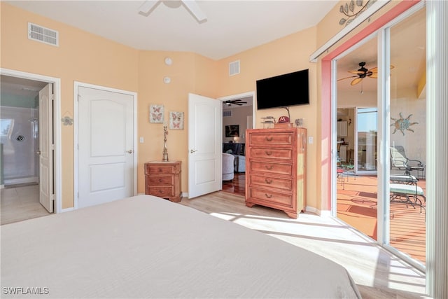 bedroom featuring multiple windows, ensuite bathroom, light hardwood / wood-style flooring, and ceiling fan