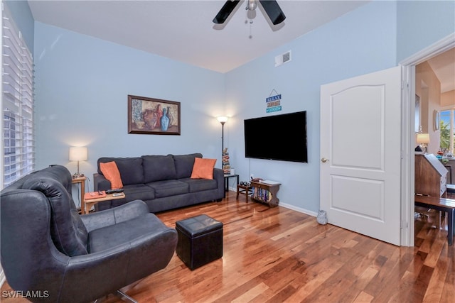 living room with ceiling fan and wood-type flooring