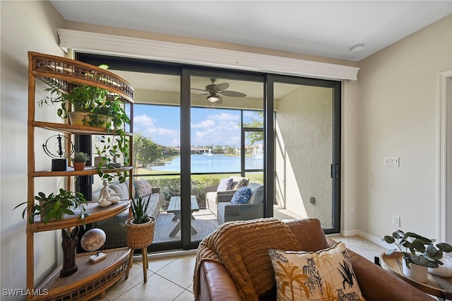 interior space featuring a water view and light tile patterned floors