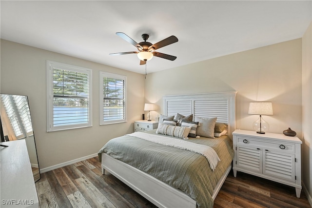 bedroom with ceiling fan and dark wood-type flooring