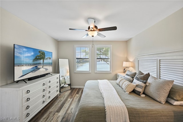 bedroom with ceiling fan and dark wood-type flooring