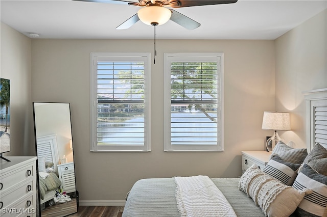 bedroom featuring ceiling fan and dark hardwood / wood-style flooring