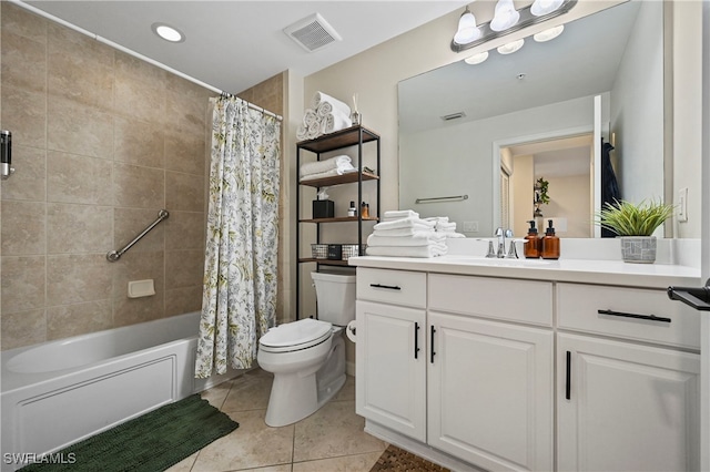 full bathroom featuring tile patterned flooring, vanity, toilet, and shower / tub combo