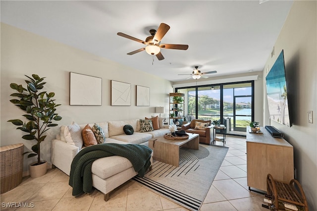 living room with ceiling fan and light tile patterned floors