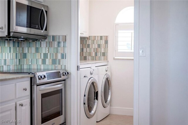 laundry room featuring washer / dryer