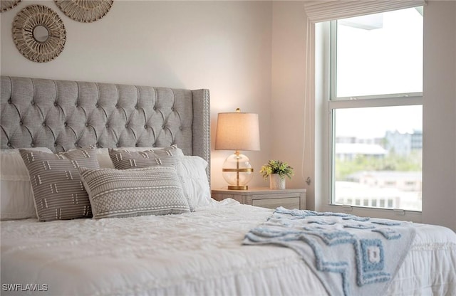 bedroom featuring multiple windows