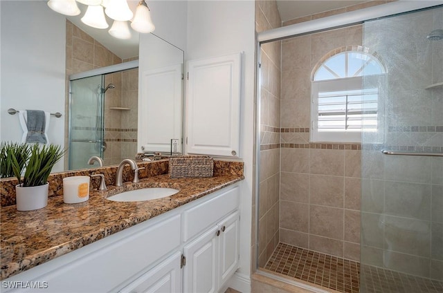 bathroom with vanity and walk in shower