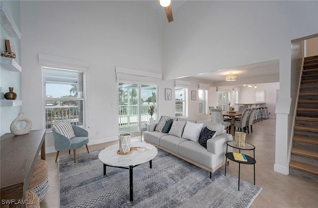 living room featuring light tile patterned flooring and a high ceiling