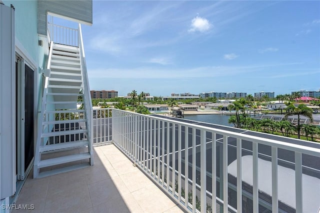 balcony featuring a water view