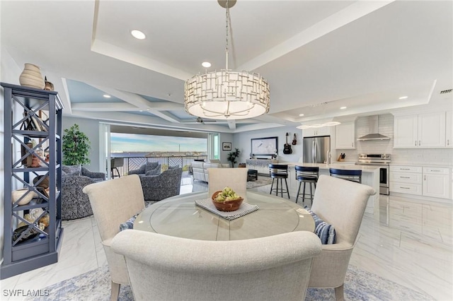 dining area with a tray ceiling