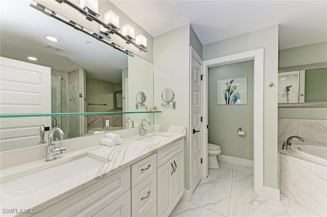 full bathroom with vanity, shower with separate bathtub, and toilet