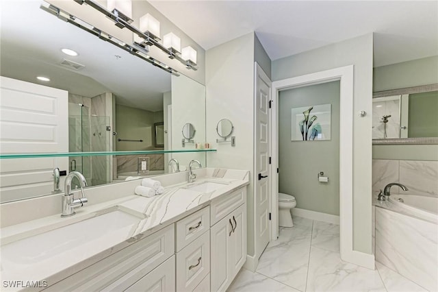 1425 Park Beach Cir Unit 149, Punta Gorda, FL 33950 - bathroom featuring marble finish flooring, a garden tub, toilet, double vanity, and baseboards