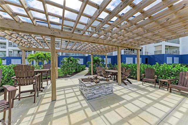 view of patio with a pergola and an outdoor fire pit