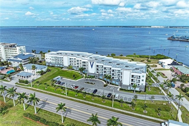 birds eye view of property with a water view