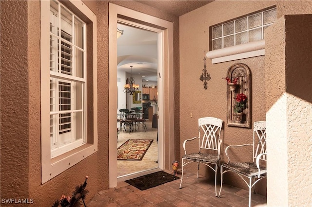 doorway to property with a patio area