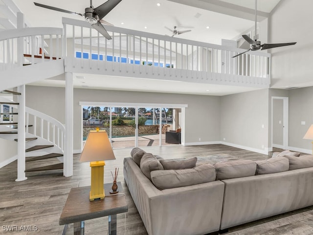 living room featuring a high ceiling and hardwood / wood-style flooring