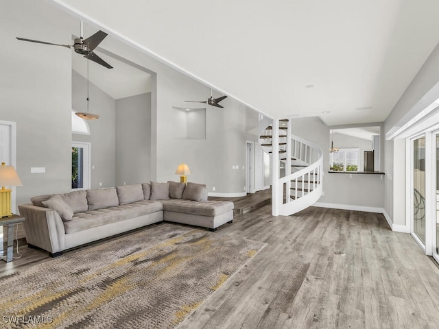 living room with lofted ceiling and light wood-type flooring