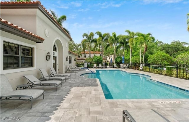 view of swimming pool with a patio