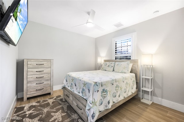 bedroom featuring ceiling fan and wood-type flooring