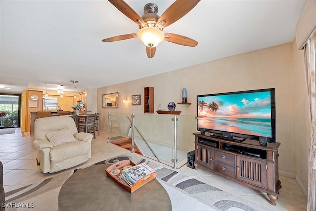 tiled living room with ceiling fan