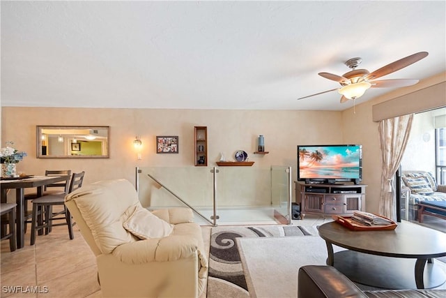 living room with light tile patterned floors and ceiling fan