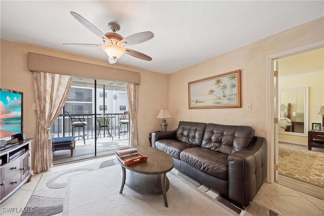 tiled living room with ceiling fan