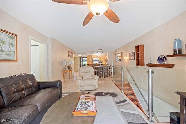 tiled living room with ceiling fan