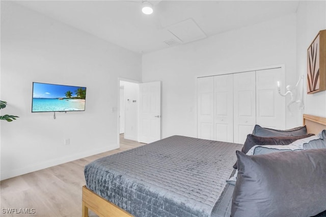 bedroom featuring a closet and hardwood / wood-style flooring