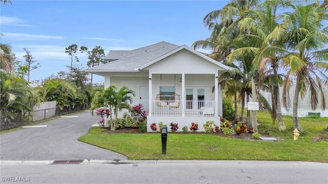 view of front facade with french doors and a front yard